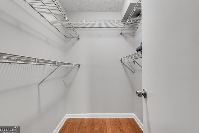 1015 Dunbar Dr, Dunwoody, GA 30338 - spacious closet with wood finished floors