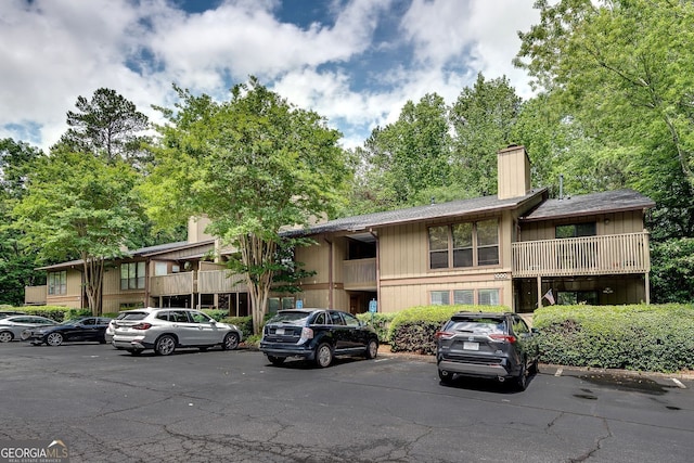 1015 Dunbar Dr, Dunwoody, GA 30338 - view of property featuring uncovered parking
