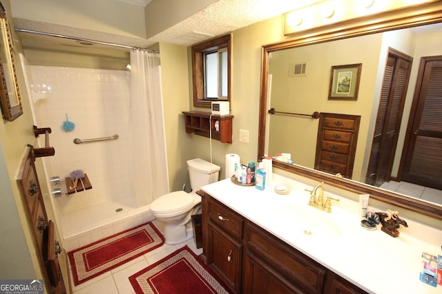 3353 Greenfield Dr, Marietta, GA 30068 - full bathroom with toilet, tile patterned flooring, a tile shower, and vanity