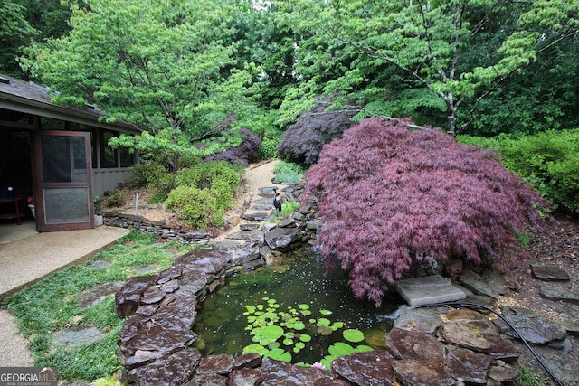 3353 Greenfield Dr, Marietta, GA 30068 - view of yard with a small pond and a sunroom