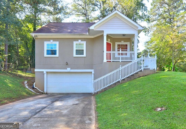 view of front of property with an attached garage, concrete driveway, covered porch, and a front yard