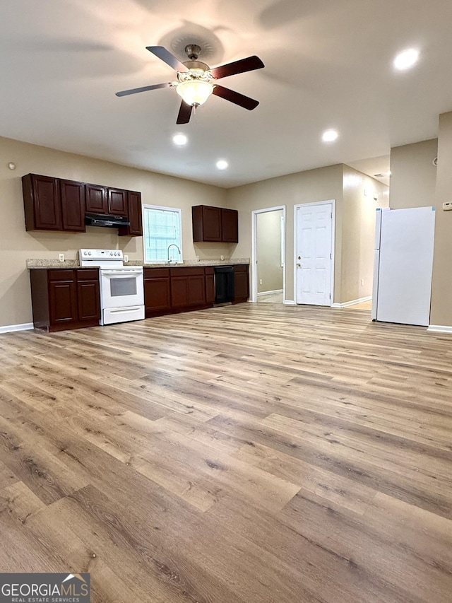 kitchen featuring white appliances, light wood-type flooring, baseboards, light countertops, and dark brown cabinetry