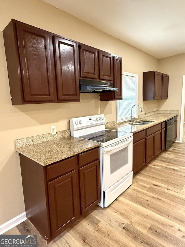 kitchen featuring electric stove, under cabinet range hood, a sink, dishwasher, and light wood finished floors
