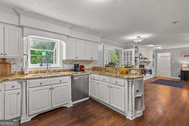 3441 Sherrod Dr SW, Marietta, GA 30060 - kitchen featuring stainless steel dishwasher, a sink, a peninsula, white cabinetry, and a textured ceiling