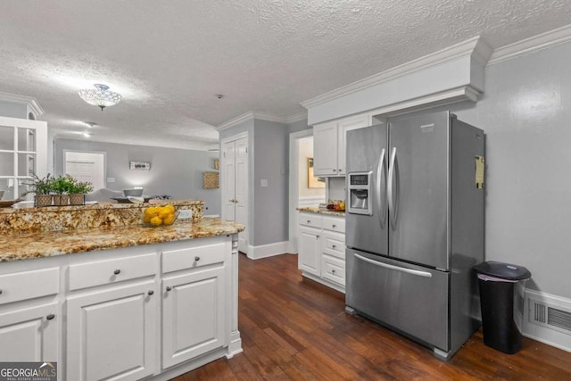 3441 Sherrod Dr SW, Marietta, GA 30060 - kitchen with stainless steel fridge with ice dispenser, a textured ceiling, dark wood finished floors, white cabinets, and crown molding