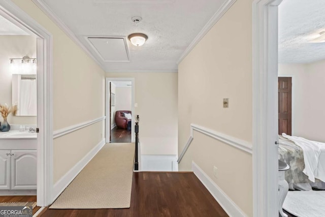 3441 Sherrod Dr SW, Marietta, GA 30060 - corridor featuring a textured ceiling, an upstairs landing, wood finished floors, crown molding, and baseboards