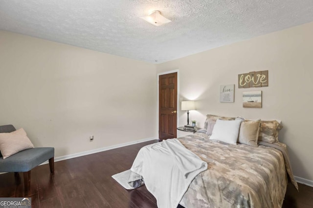 3441 Sherrod Dr SW, Marietta, GA 30060 - bedroom with a textured ceiling, wood finished floors, and baseboards