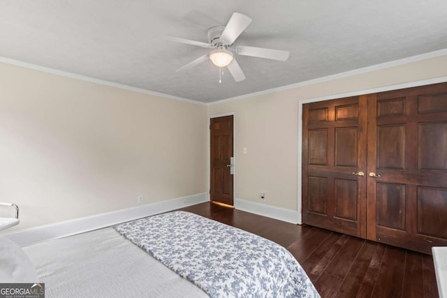 3441 Sherrod Dr SW, Marietta, GA 30060 - unfurnished bedroom with dark wood-style floors, baseboards, ornamental molding, and a ceiling fan