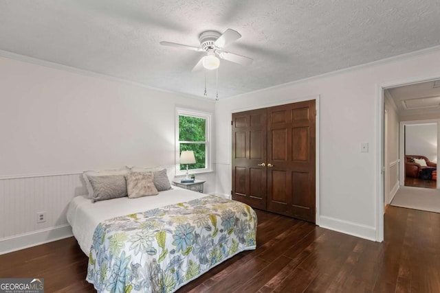 3441 Sherrod Dr SW, Marietta, GA 30060 - bedroom featuring wood finished floors, a closet, ornamental molding, a ceiling fan, and a textured ceiling