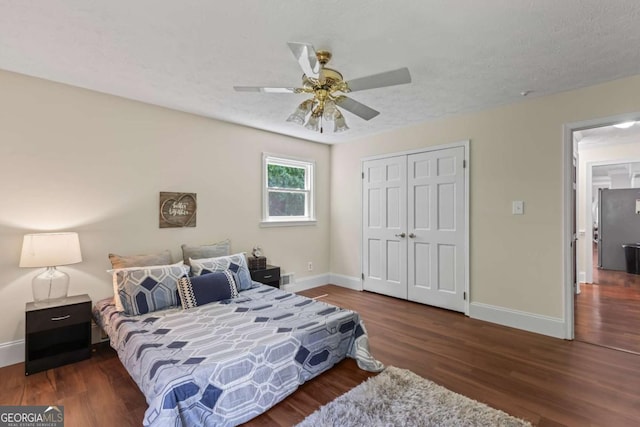 3441 Sherrod Dr SW, Marietta, GA 30060 - bedroom with baseboards, wood finished floors, a closet, and freestanding refrigerator