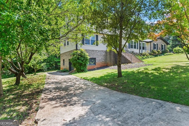 3441 Sherrod Dr SW, Marietta, GA 30060 - view of front of house with brick siding, driveway, and a front yard