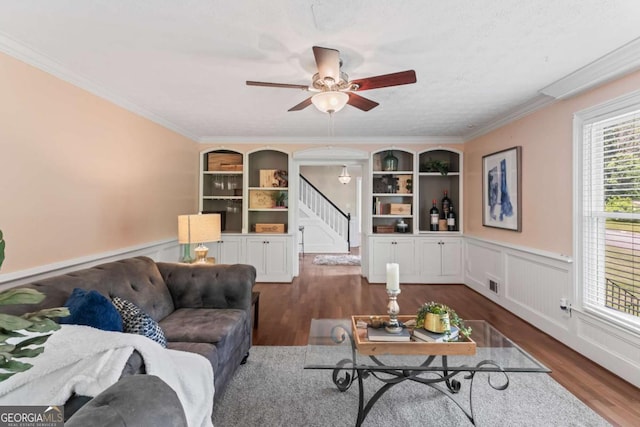 3441 Sherrod Dr SW, Marietta, GA 30060 - living area with stairway, wood finished floors, ceiling fan, wainscoting, and ornamental molding