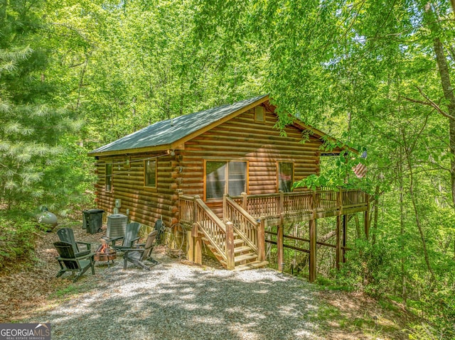 7 Ascherman Ct, Blue Ridge, GA 30513 - view of outdoor structure with central AC, an outdoor fire pit, and a wooded view