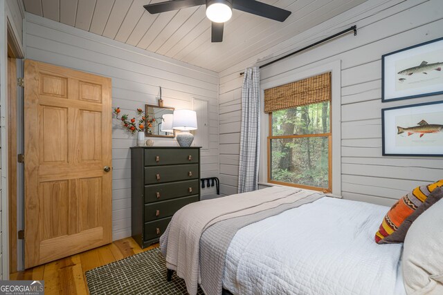 7 Ascherman Ct, Blue Ridge, GA 30513 - bedroom with wooden walls, wood-type flooring, and a ceiling fan