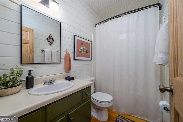 7 Ascherman Ct, Blue Ridge, GA 30513 - bathroom with toilet, wooden walls, vanity, a shower with shower curtain, and wood finished floors