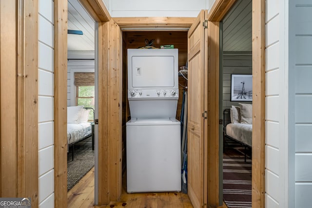 7 Ascherman Ct, Blue Ridge, GA 30513 - laundry room with stacked washer and clothes dryer, wood finished floors, and wood walls