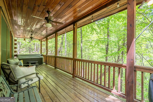 7 Ascherman Ct, Blue Ridge, GA 30513 - sunroom / solarium featuring a ceiling fan, a jacuzzi, and a wooded view