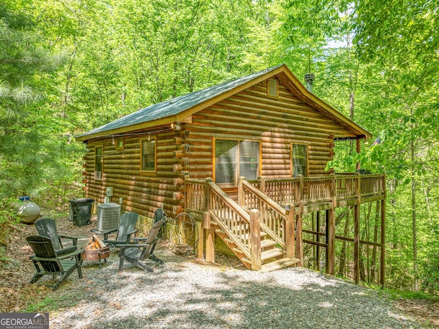 7 Ascherman Ct, Blue Ridge, GA 30513 - view of outbuilding featuring a fire pit, stairway, a view of trees, and cooling unit