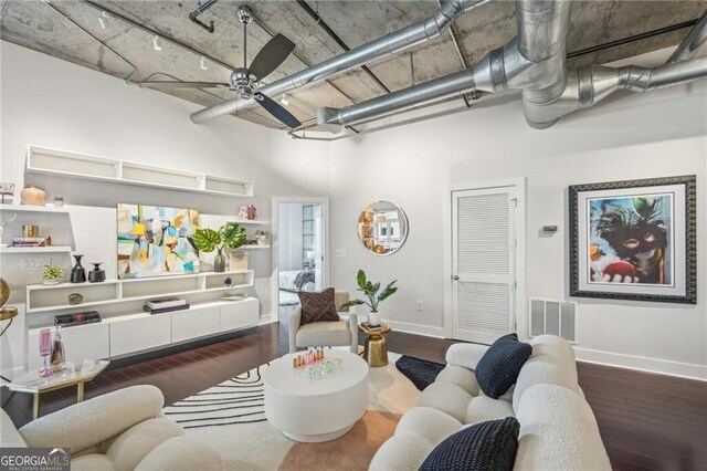 206 NE 11th St NE Unit Ph703, Atlanta, GA 30309 - living area with hardwood / wood-style flooring, baseboards, ceiling fan, and a high ceiling