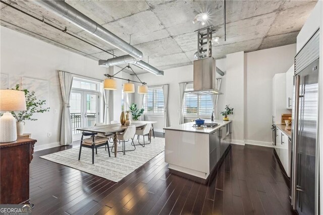 206 NE 11th St NE Unit Ph703, Atlanta, GA 30309 - kitchen featuring a peninsula, baseboards, french doors, and dark wood-style floors