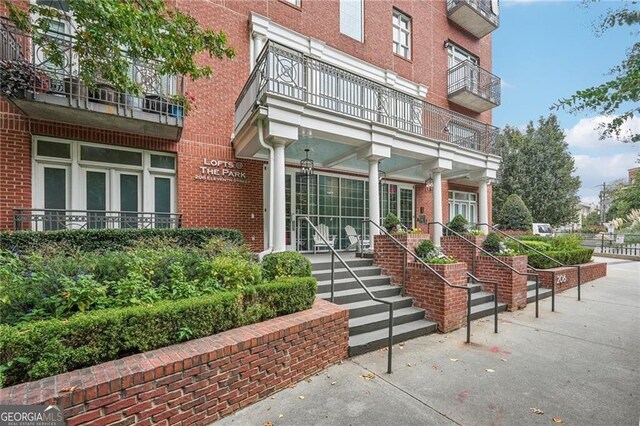 206 NE 11th St NE Unit Ph703, Atlanta, GA 30309 - entrance to property featuring brick siding and a balcony