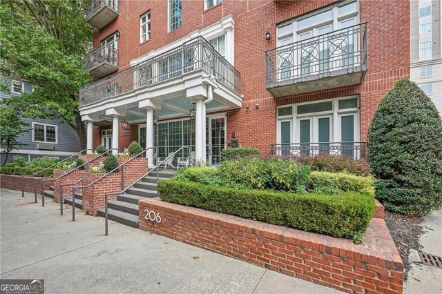 206 NE 11th St NE Unit Ph703, Atlanta, GA 30309 - property entrance featuring brick siding