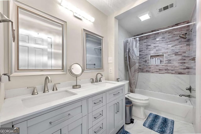 bathroom with shower / bath combo, double vanity, and toilet