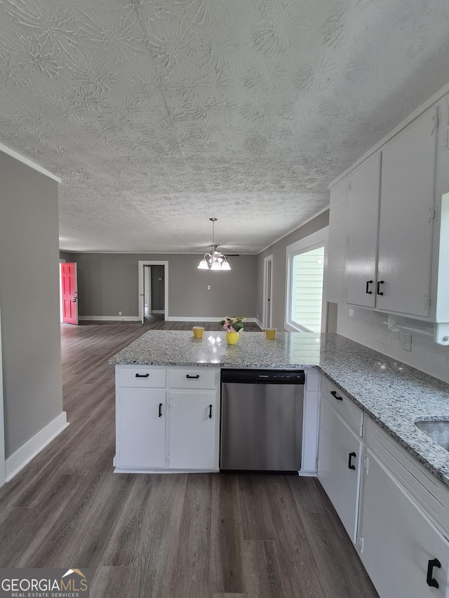 kitchen featuring stainless steel dishwasher, dark wood-style floors, open floor plan, white cabinets, and a peninsula