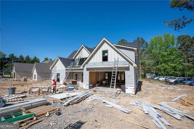 140 Cambridge Ct, Calhoun, GA 30701 - rear view of property featuring board and batten siding