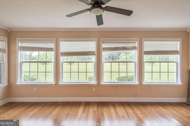 3842 Kay Cir, Blackshear, GA 31516 - unfurnished room with light wood-style flooring, baseboards, a textured ceiling, and a ceiling fan