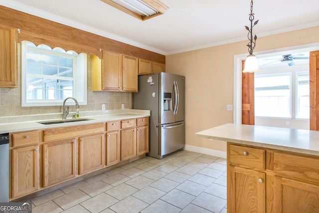 3842 Kay Cir, Blackshear, GA 31516 - kitchen featuring appliances with stainless steel finishes, a sink, light countertops, ornamental molding, and tasteful backsplash