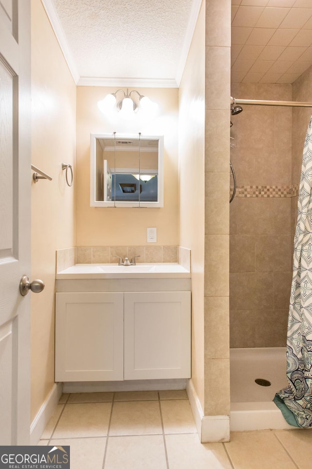 3842 Kay Cir, Blackshear, GA 31516 - full bathroom featuring ornamental molding, a tile shower, tile patterned floors, vanity, and baseboards