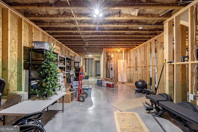 unfinished below grade area featuring electric water heater