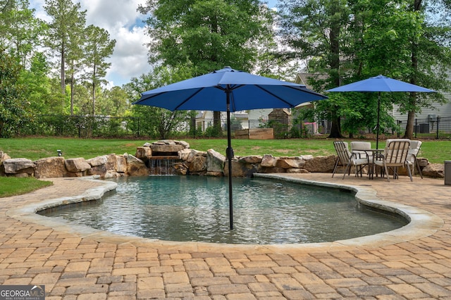 view of pool featuring a patio