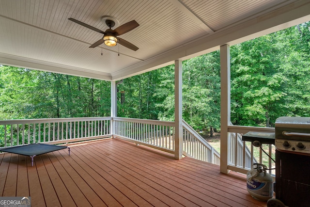 wooden terrace with a ceiling fan