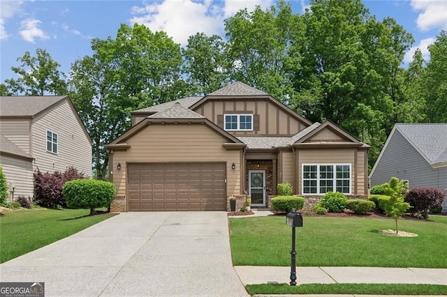 3365 Buffington Ln, Cumming, GA 30040 - view of front of property with a garage, concrete driveway, board and batten siding, a front lawn, and a shingled roof