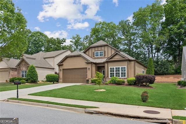 3365 Buffington Ln, Cumming, GA 30040 - craftsman inspired home featuring a front lawn, concrete driveway, an attached garage, and board and batten siding