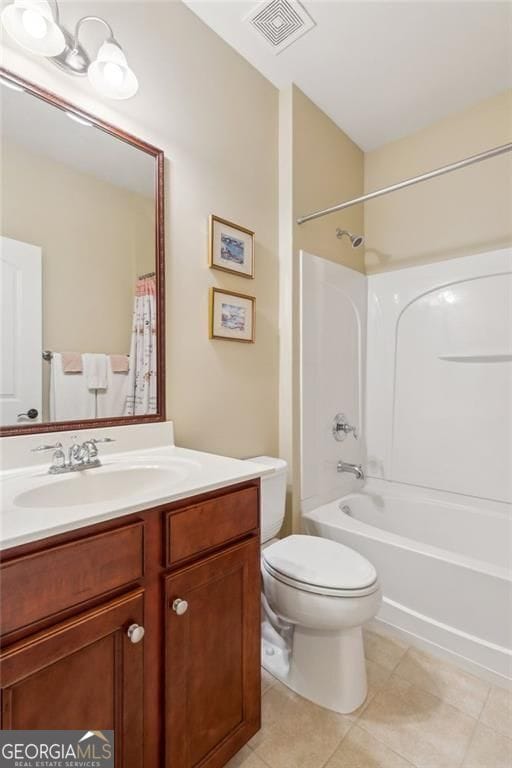 3365 Buffington Ln, Cumming, GA 30040 - bathroom featuring toilet, vanity, shower / bath combo with shower curtain, and tile patterned floors