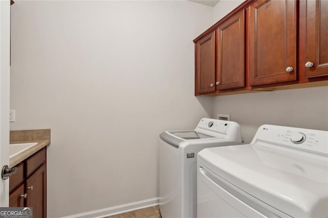 3365 Buffington Ln, Cumming, GA 30040 - laundry area with washer and clothes dryer, cabinet space, and baseboards