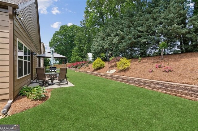 3365 Buffington Ln, Cumming, GA 30040 - view of grassy yard featuring a patio area