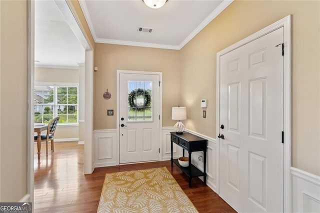 3365 Buffington Ln, Cumming, GA 30040 - entryway with ornamental molding, dark wood-type flooring, and a wainscoted wall