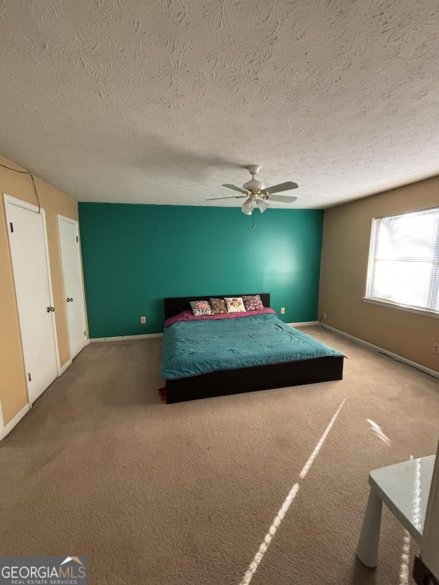 3709 Charlotte Dr, Rex, GA 30273 - bedroom with carpet, a textured ceiling, baseboards, and ceiling fan