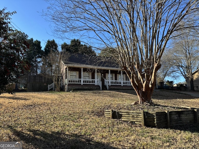 3709 Charlotte Dr, Rex, GA 30273 - view of front of property featuring covered porch and fence