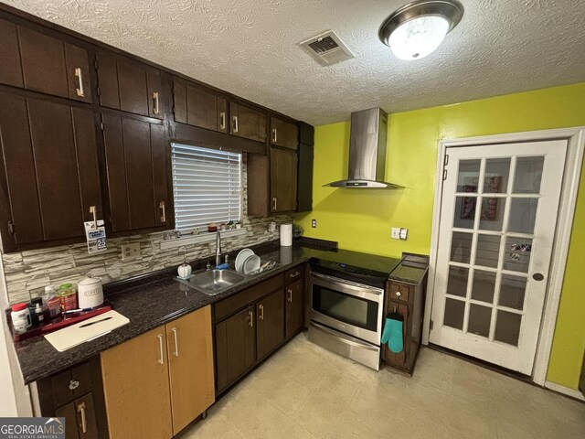 3709 Charlotte Dr, Rex, GA 30273 - kitchen with wall chimney range hood, electric range, a sink, tasteful backsplash, and dark brown cabinetry