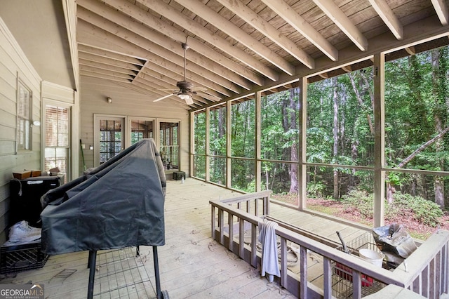 sunroom / solarium with a ceiling fan