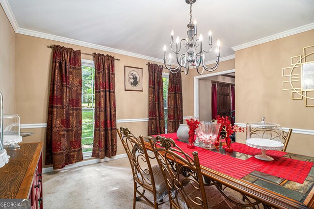 dining space with a chandelier, baseboards, crown molding, and carpet floors