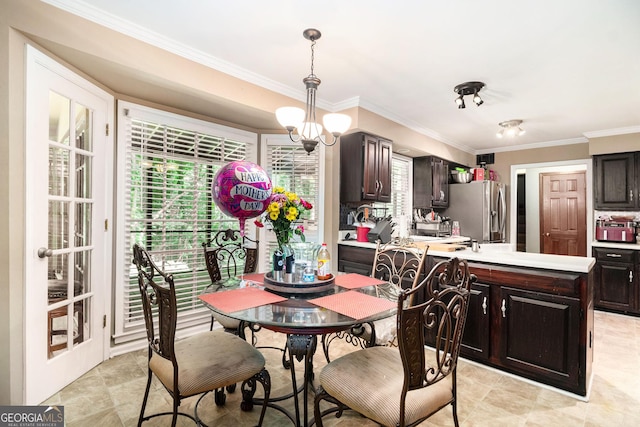 dining space featuring ornamental molding and plenty of natural light
