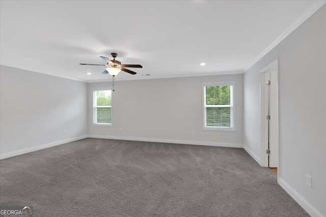 empty room with crown molding, baseboards, ceiling fan, dark colored carpet, and recessed lighting