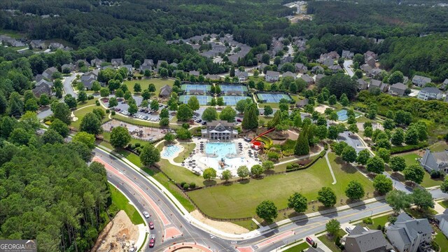 116 Daffodil Lndg, Dallas, GA 30132 - aerial perspective of suburban area featuring a pool and a heavily wooded area