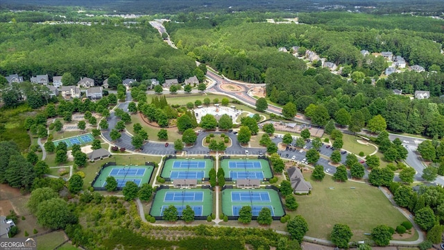 aerial view of property's location featuring a heavily wooded area